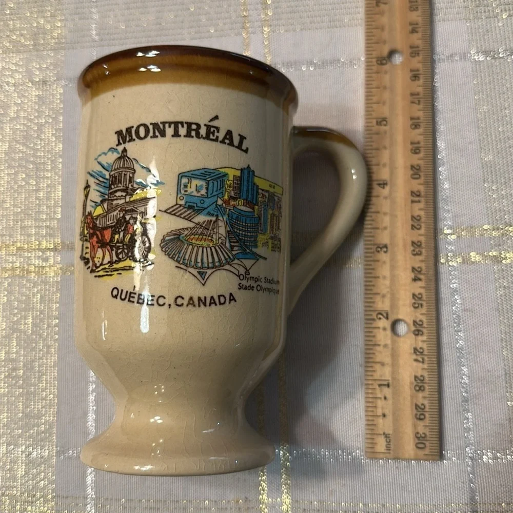 Vintage ceramic souvenir coffee mug with illustration of Montreal Quebec OS